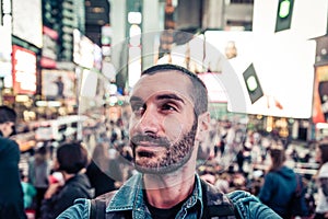 Backpacker tourist taking selfie in Time square