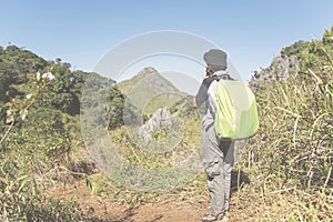 Backpacker traveler with backpack in mountaineering Travel