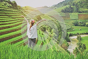 backpacker with valley rice terraces of a mountain at sapa