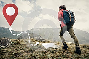 Backpacker woman going up on mountain to GPS route.