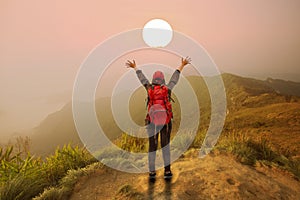 Backpacker woman open hand on mountain