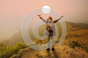 Backpacker woman open hand on mountain