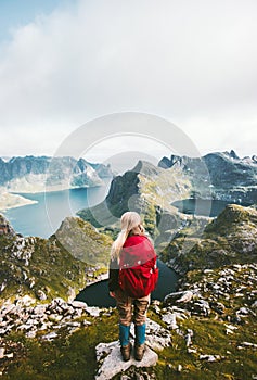 Backpacker woman standing alone in mountains