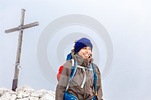 Backpacker woman tourist standing Peitlerkofel mountain summit Italy