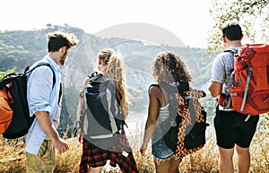 Backpackers on an adventure together in summer