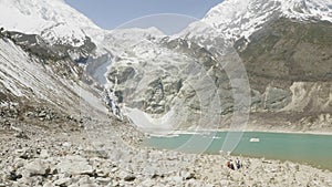 Backpackers on the mountain lake Birendra in Nepal. Manaslu area.