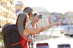 Backpackers taking photos on summer vacation photo