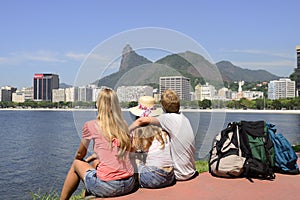 Backpackers tourists in Rio de Janeiro looking at Christ the Redeemer.