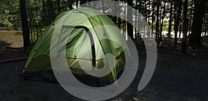 Backpacking tent in a dark campsite