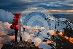 Backpacking on top of a mountain Cliff.