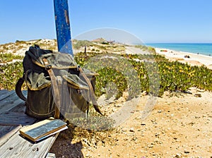 Backpacking traveller in a beach rest. Tavira island, Algarve. Portugal