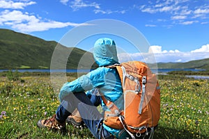 Backpacking woman hiking in mountains