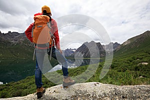 Backpacking woman hiking in mountains