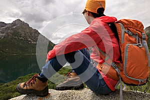 Backpacking woman hiking in mountains