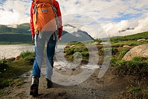 Backpacking woman hiking in mountains