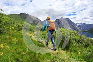 Backpacking woman hiking in the nature