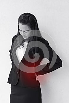 Backpain of business woman, concept of office syndrome photo