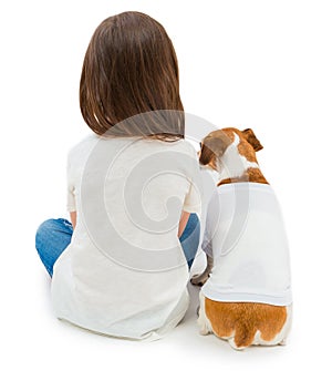 Backs of Friends small girl and her dog sitting down in same white T-shirt . photo