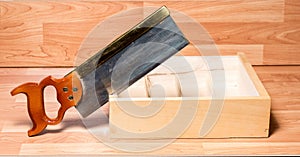 Backsaw cuts into a wooden box