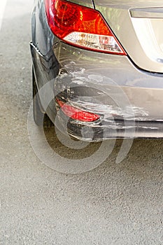 Backside of new silver car get scratched, damaged by accident on parking