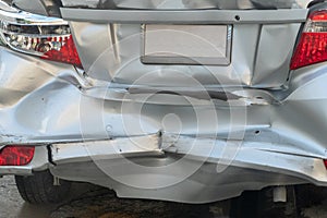 Backside silver car get damaged by crash accident on the road
