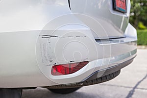 Backside of silver SUV car get scratched, damaged by accident