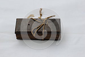 Backside view of a Palm leaf manuscript book tide with thick rope