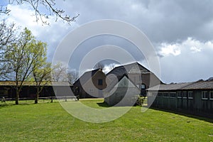 Backsite of a farm on a clouded day in spring