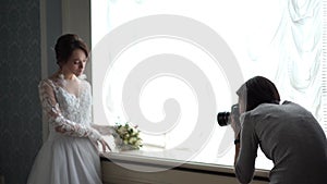 Backstage wedding photography - professional photographers take pictures of newlyweds in a chic room