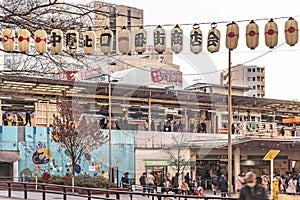 Backstreet of Nakano Station place decorated with Japanese paper lanterns where is inscribed Nakano North Gate Shopping Street