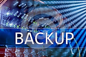 Backup button on modern server room background. Data loss prevention. System recovery.