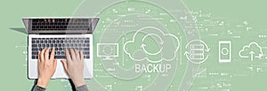 Backup concept with person using laptop computer