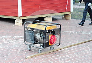Backup Portable Generator for repair. Mobile Backup Generator on house construction site