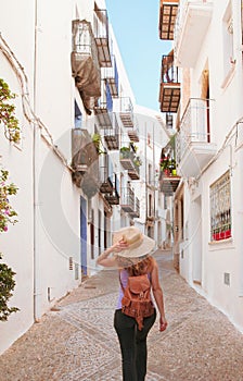 Backview of woman walking in spanish street