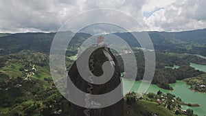 Backwards aerial drone view of La Piedra del PeÃ±ol in Colombia