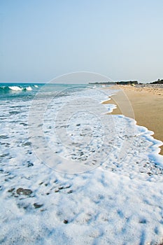 Backwash and sea foam in Calabria south Italy photo