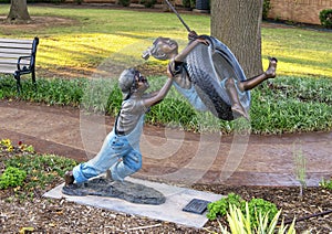 Backyard Adventure by Missy Vandable, bronze sculpture in Edmond, Oklahoma