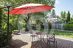 Backyard Garden with Bright Orange Cantilever Umbrella 2