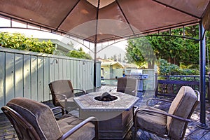 Backyard gazebo with patio set