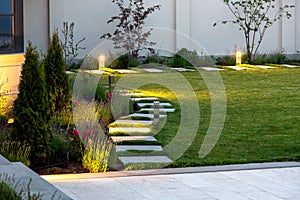 Backyard of the mansion with a flowerbed.