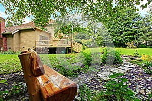 Backyard outdoor rest area with wooden bench