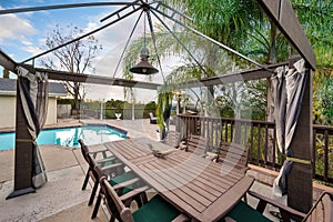 Backyard with a pool, patio, and gazebo in Encino, CA