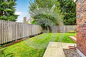 Backyard with wooden fence and walkway