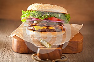 Bacon cheese burger with pickles tomato onion