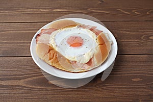 Bacon egg bread on plate isolated on table