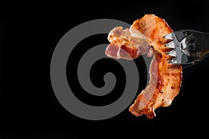 Bacon, Fresh Slice of Delicious Bacon held with a fork