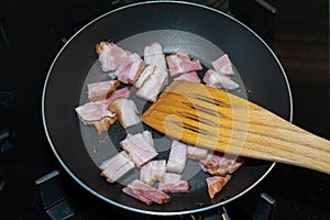 Bacon fried in a pan like the basis of good scrambled eggs.