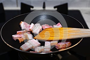 Bacon fried in a pan like the basis of good scrambled eggs.