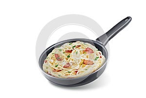 Bacon garlic parsley pasta in a black pan on a white isolated background