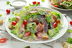 Bacon Lettuce Tomato, BLT salad with creamy dressing sauce, croutons